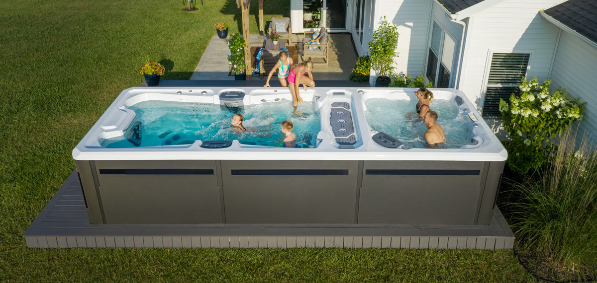 A family enjoying time in a swim spa.