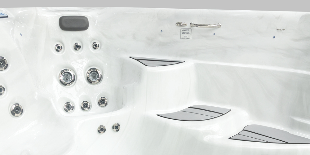Jets and steps to get into a swim spa.